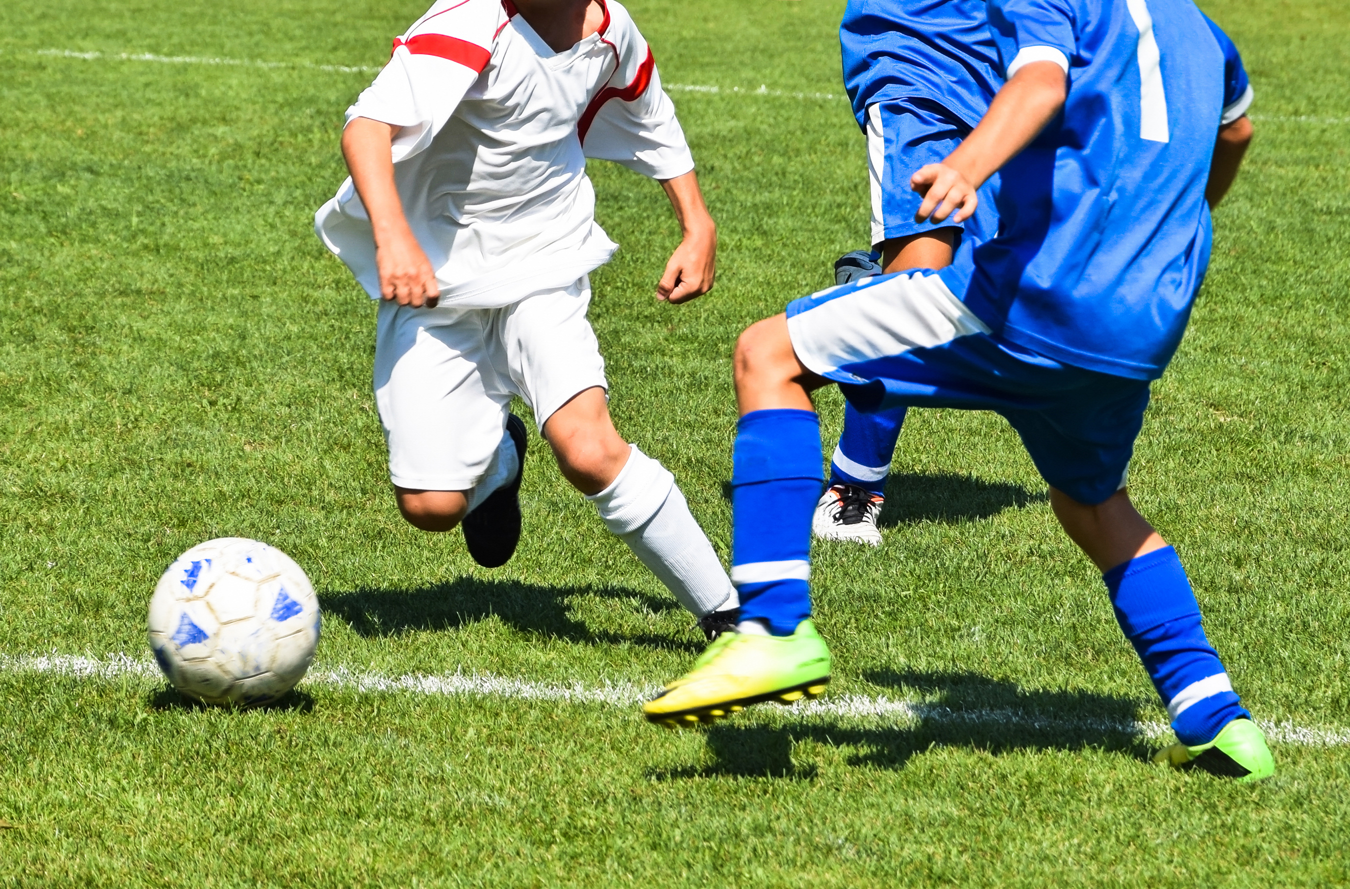 Young soccer players in action - BETHANYSOCCERCAMPS.COM